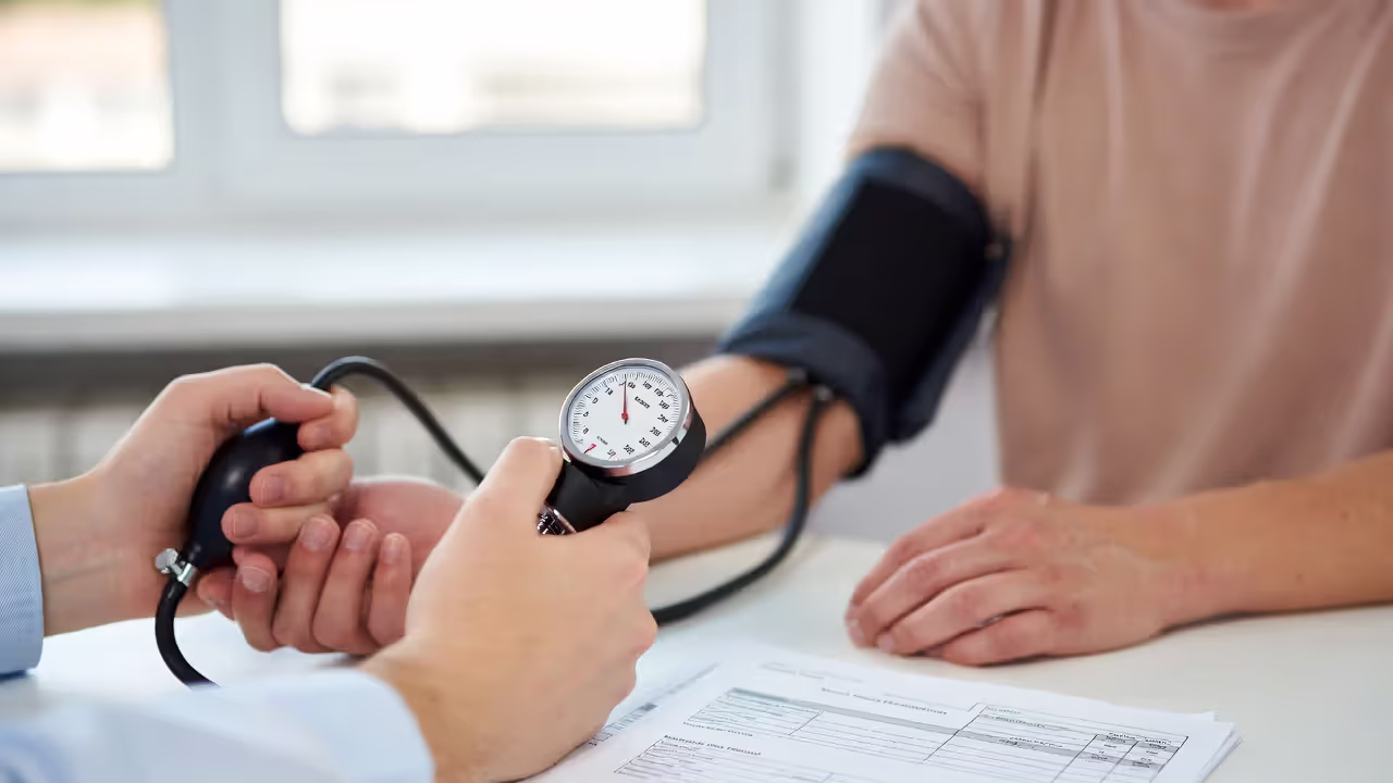 Blood pressure check during a medical exam for insurance underwriting